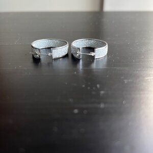 Sterling silver glitter hoop earrings.